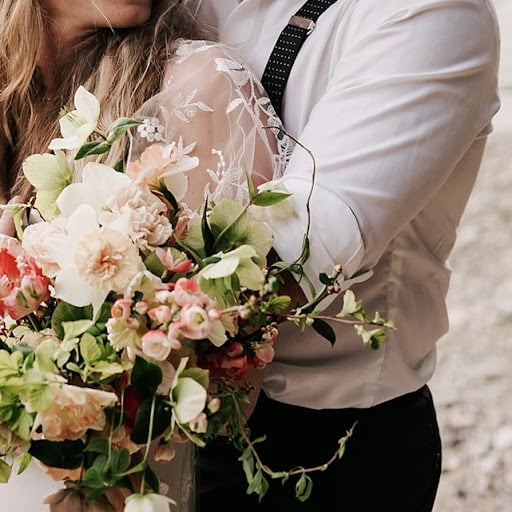 Couple with spring wedding flowers