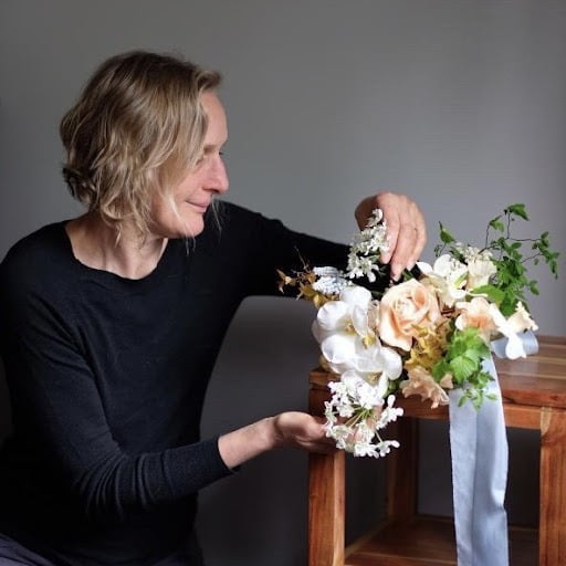 Lexi with floral arrangement