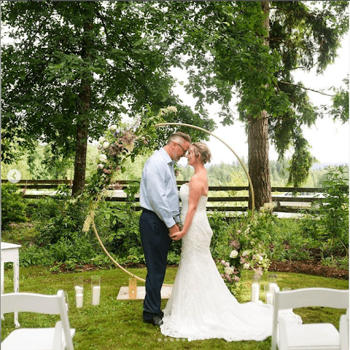 Wedding Couple with floral archArch