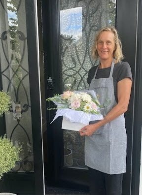 Head Designer Lexi Richards with flowers