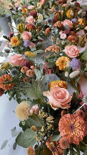 Floral arrangements spread out on a table