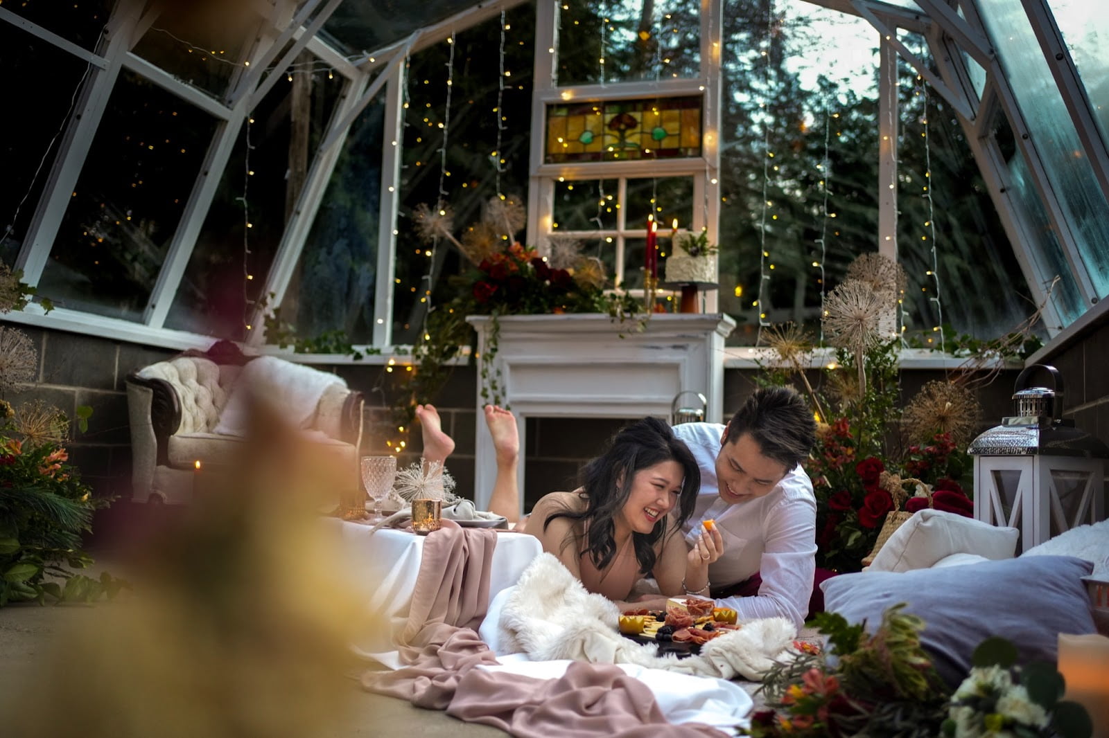 Romantic picnic wedding proposal in decorated greenhouse