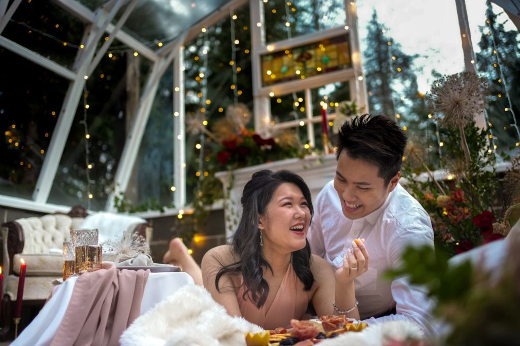 Wedding couple lounge in decorated greenhouse together