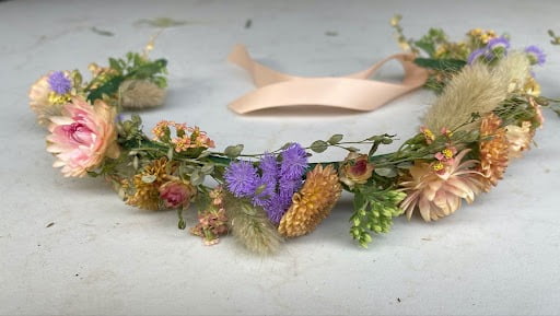 Flower crown: Flowers arranged and shaped into a circlet to wear on the head.