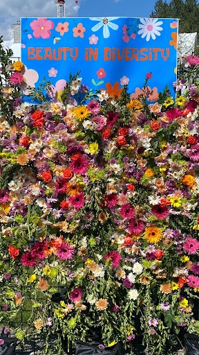 Wall of Flowers with a sign that reads Beauty in Diversity